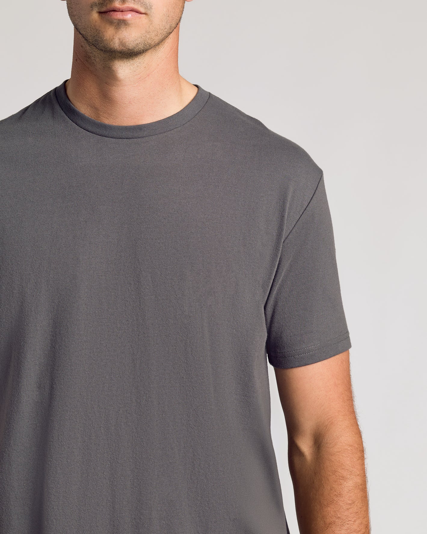 Carbon Short Sleeve Tall Curved Hem Crew on model, showcasing fit and style.