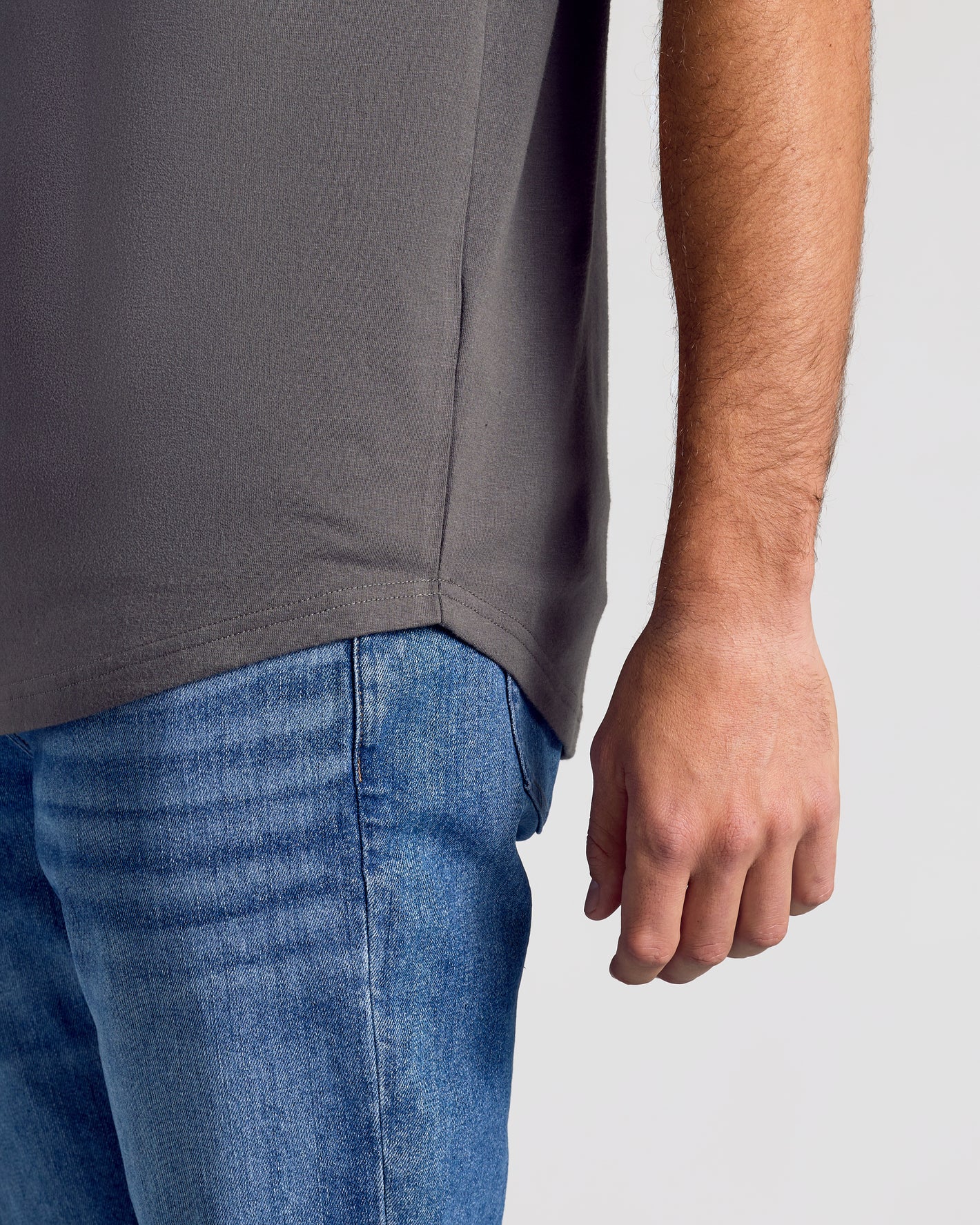 Carbon Short Sleeve Tall Curved Hem Crew worn with blue jeans.