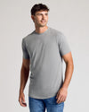 Heather Gray Short Sleeve Tall Curved Hem Crew on young man, side pose.
