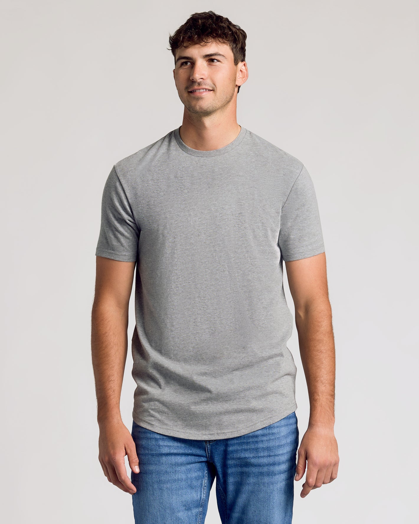 Heather Gray Short Sleeve Tall Curved Hem Crew on a relaxed young man.