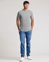 Young man wearing Heather Gray Short Sleeve Tall Curved Hem Crew.