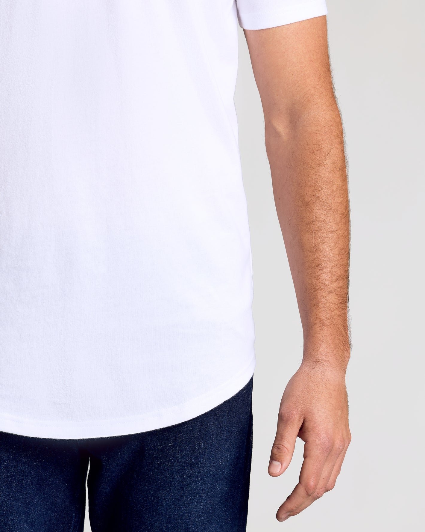 White Classic Tall Curved Hem Crew 10-Pack worn with dark jeans.