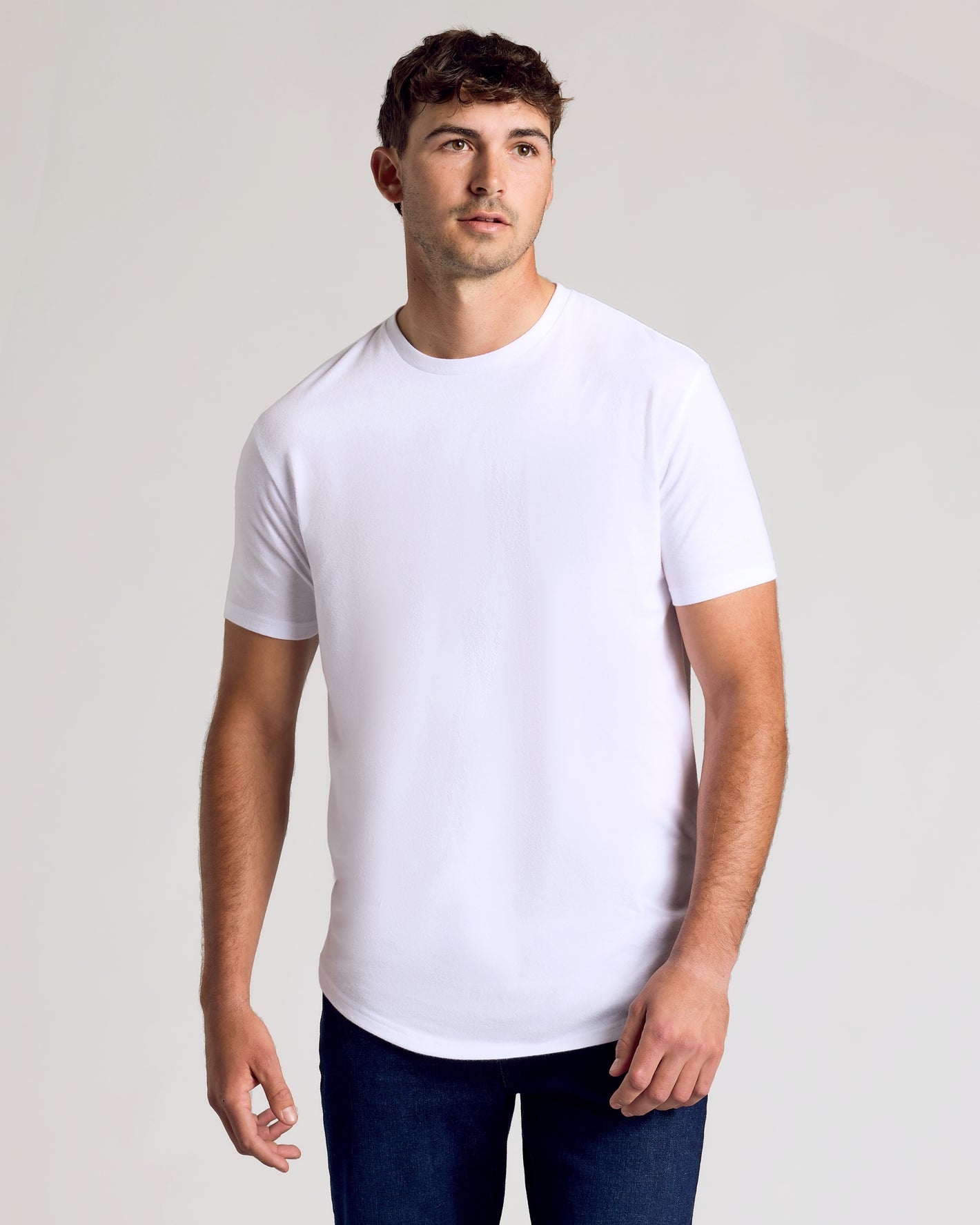 All White Short Sleeve Tall Curved Hem Crew worn by man.