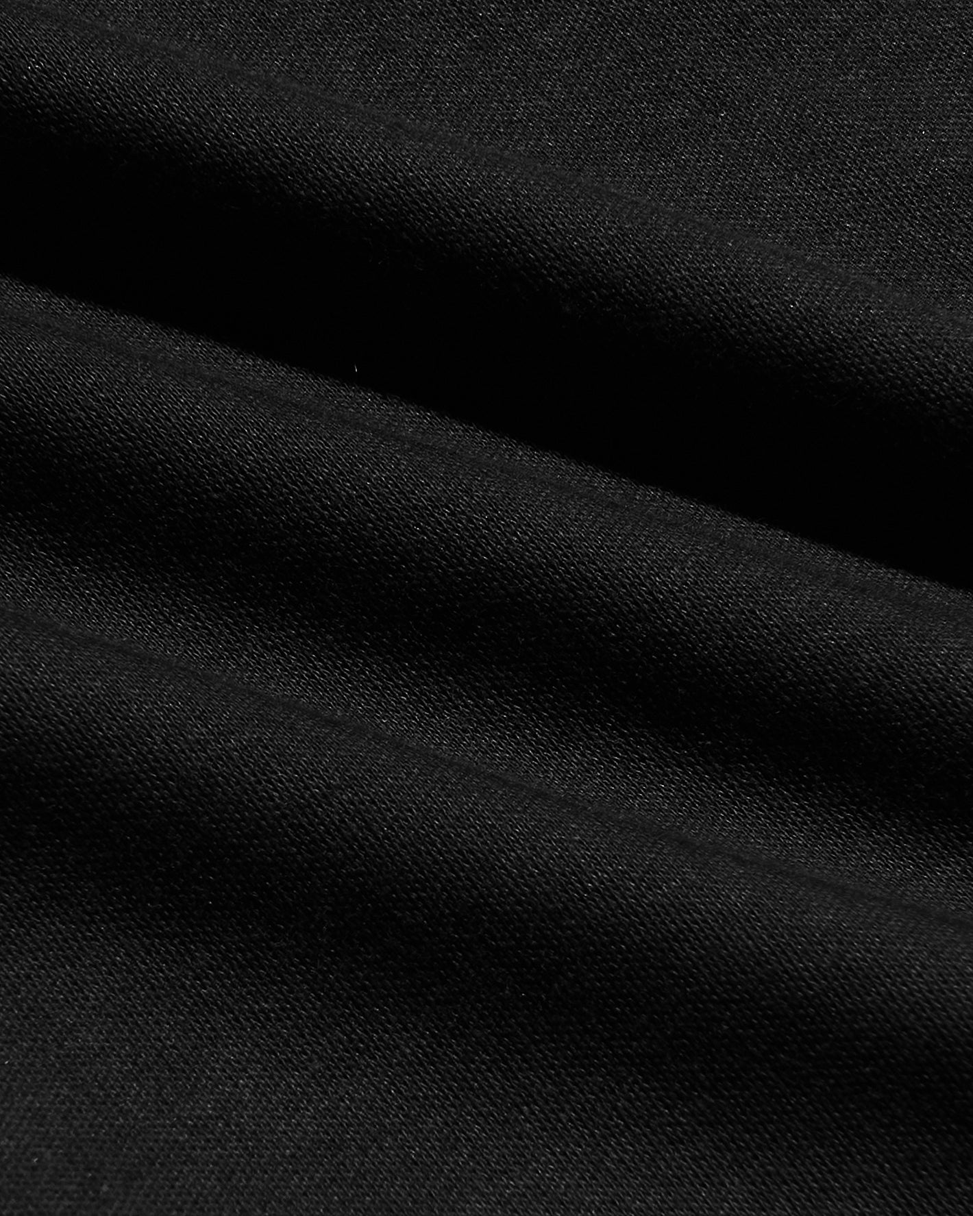 Black Tall Premium Pima Crew Curved Hem 4-Pack, close-up of woven texture.