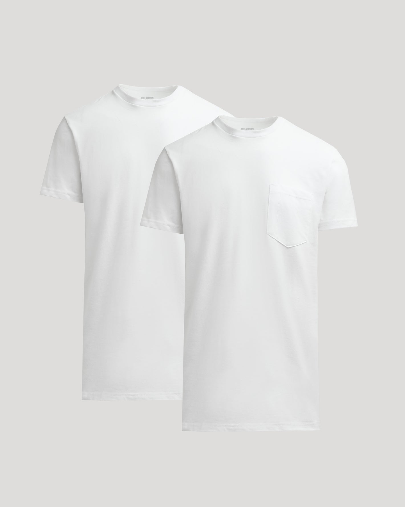 Two white t-shirts on a light gray background