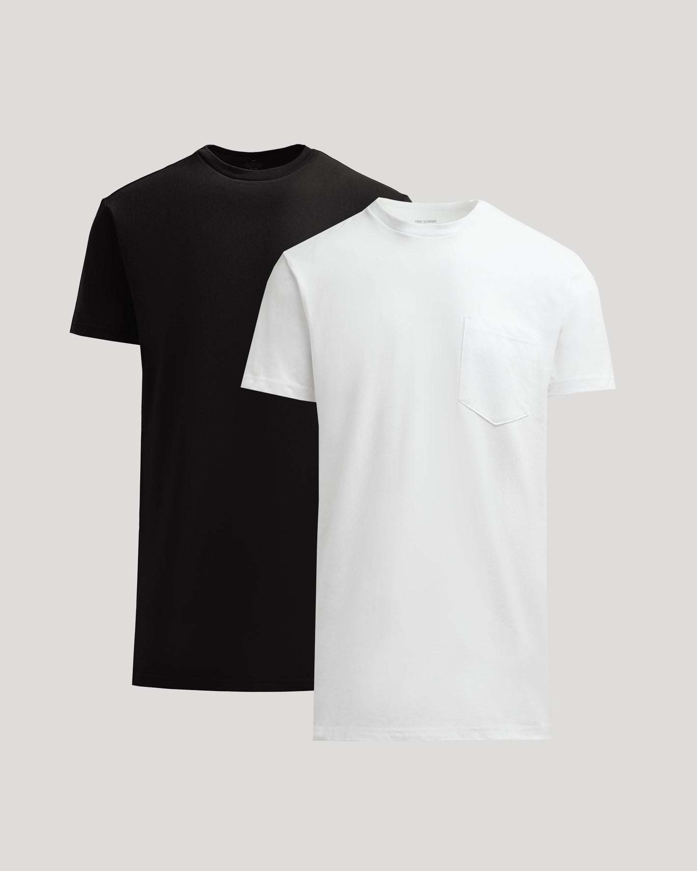 Black and white t-shirts on a light gray background