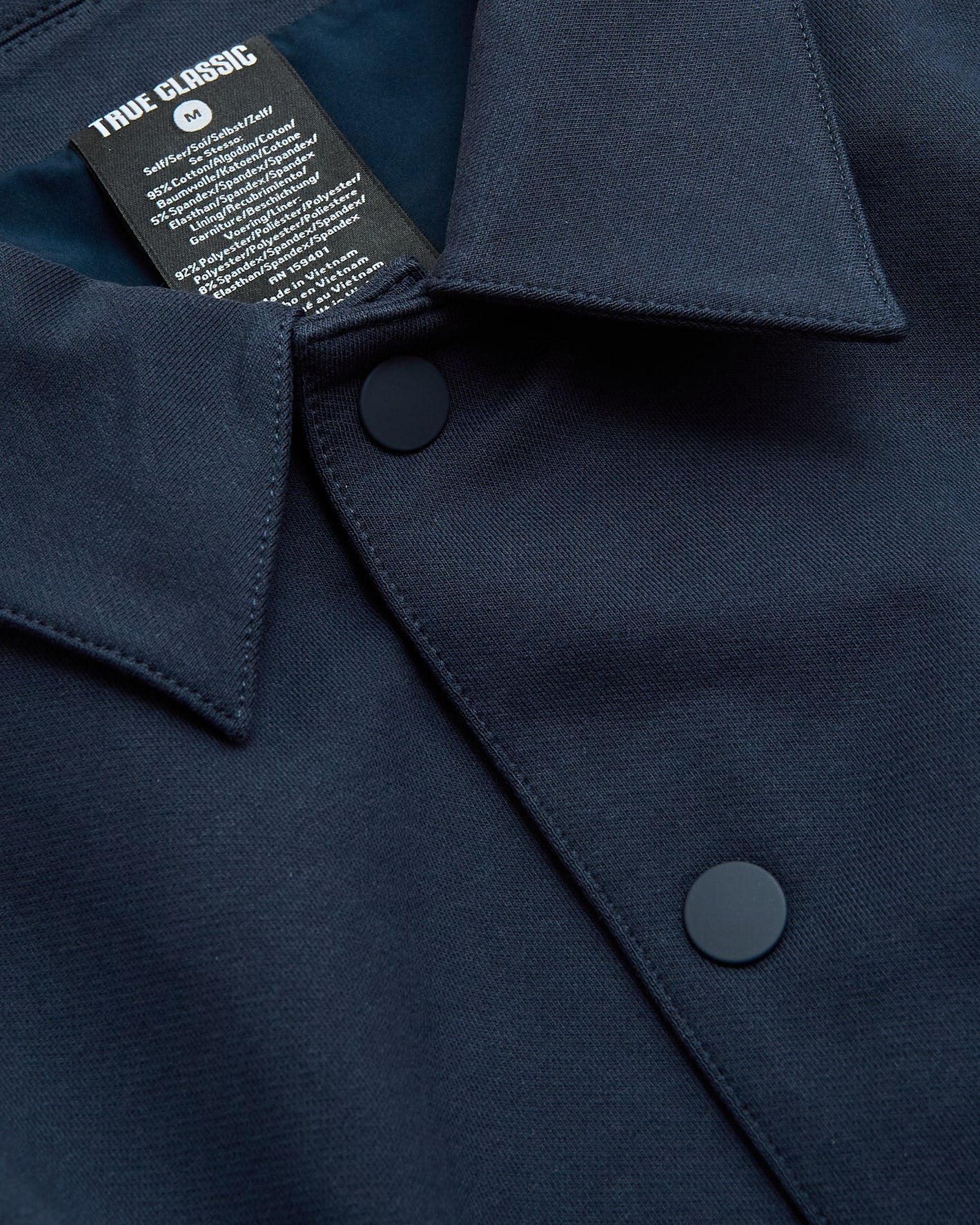 Navy Casual Jacket with matte snap buttons and TRUE CLASSIC label.