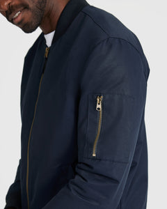 True ClassicNavy Bomber Jacket with brass zipper and sleeve pocket.