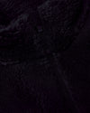 Black Sherpa Full Zip Jacket close-up showing soft fleece texture and zipper.