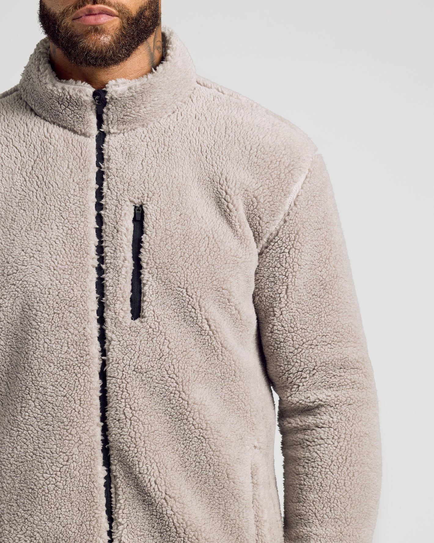 Taupe Sherpa Full Zip Jacket with chest zip pocket.