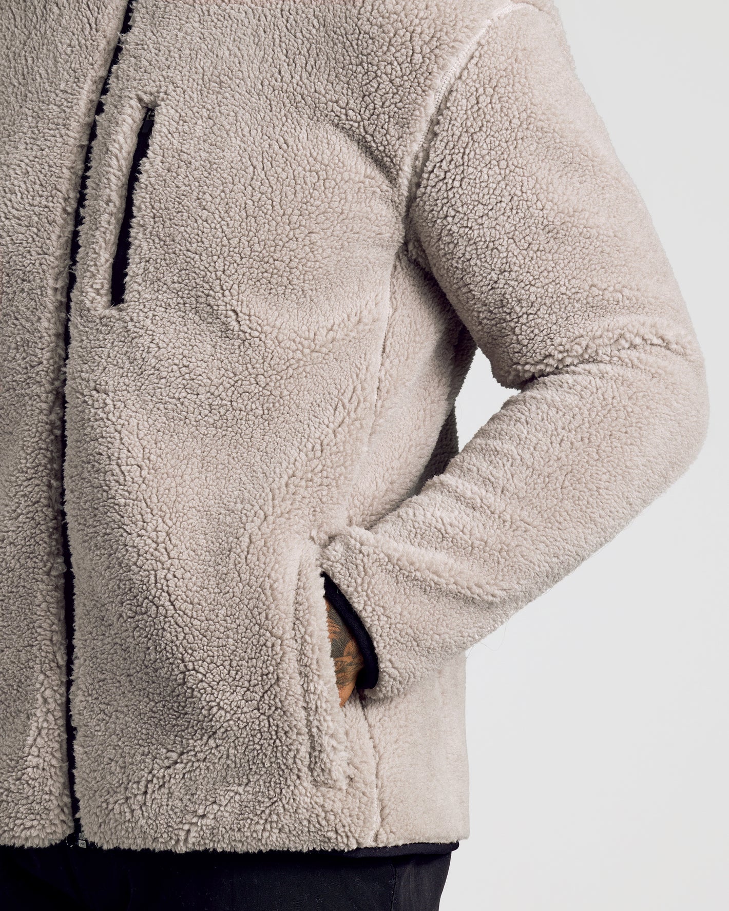 Taupe Sherpa Full Zip Jacket with chest zip pocket and side-entry pockets.