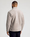 Man wearing Taupe Sherpa Full Zip Jacket, showcasing its cozy, fluffy texture.
