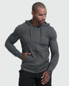 Man in Spike Training Top and Bottom 3-Pack, hoodie visible.
