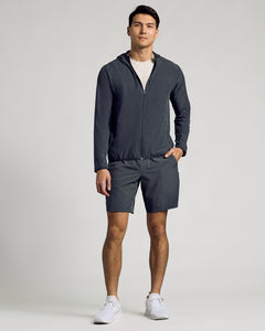 True ClassicYoung man models Charcoal Heather Gray Active Shell Jacket in athletic wear.