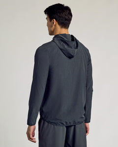 True ClassicMan wearing Charcoal Heather Gray Active Shell Jacket, hood down, back view.