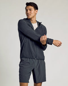 True ClassicYoung man stretches in Charcoal Heather Gray Active Shell Jacket.
