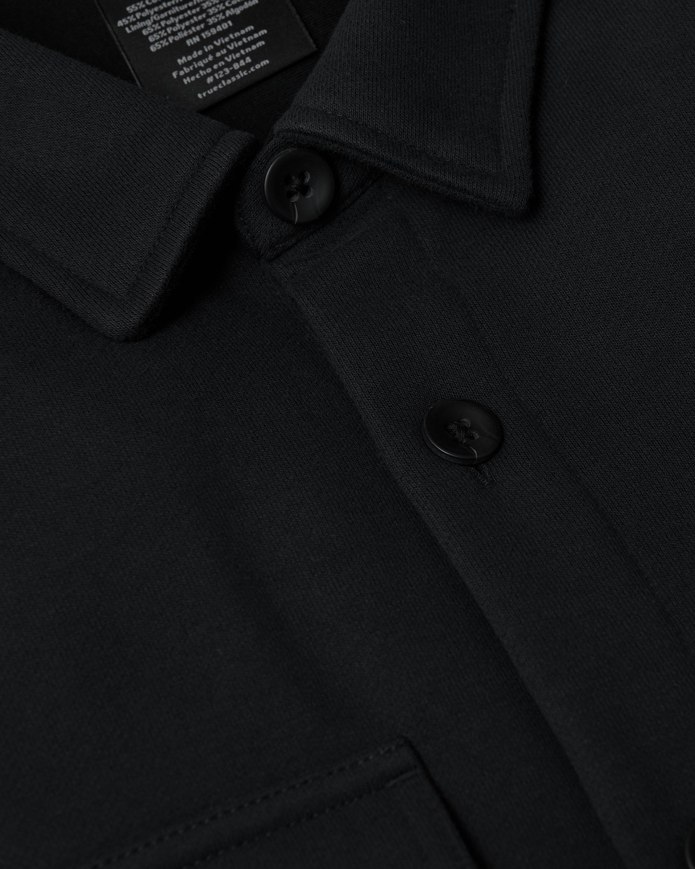 Black Fleece Shirt Jacket with buttons and patch pocket detail.