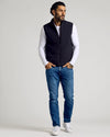 Black Puffer Vest worn over white T-shirt, paired with jeans.