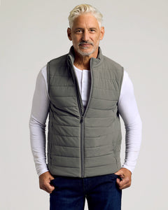 True ClassicMan wearing Carbon Puffer Vest over white henley shirt.