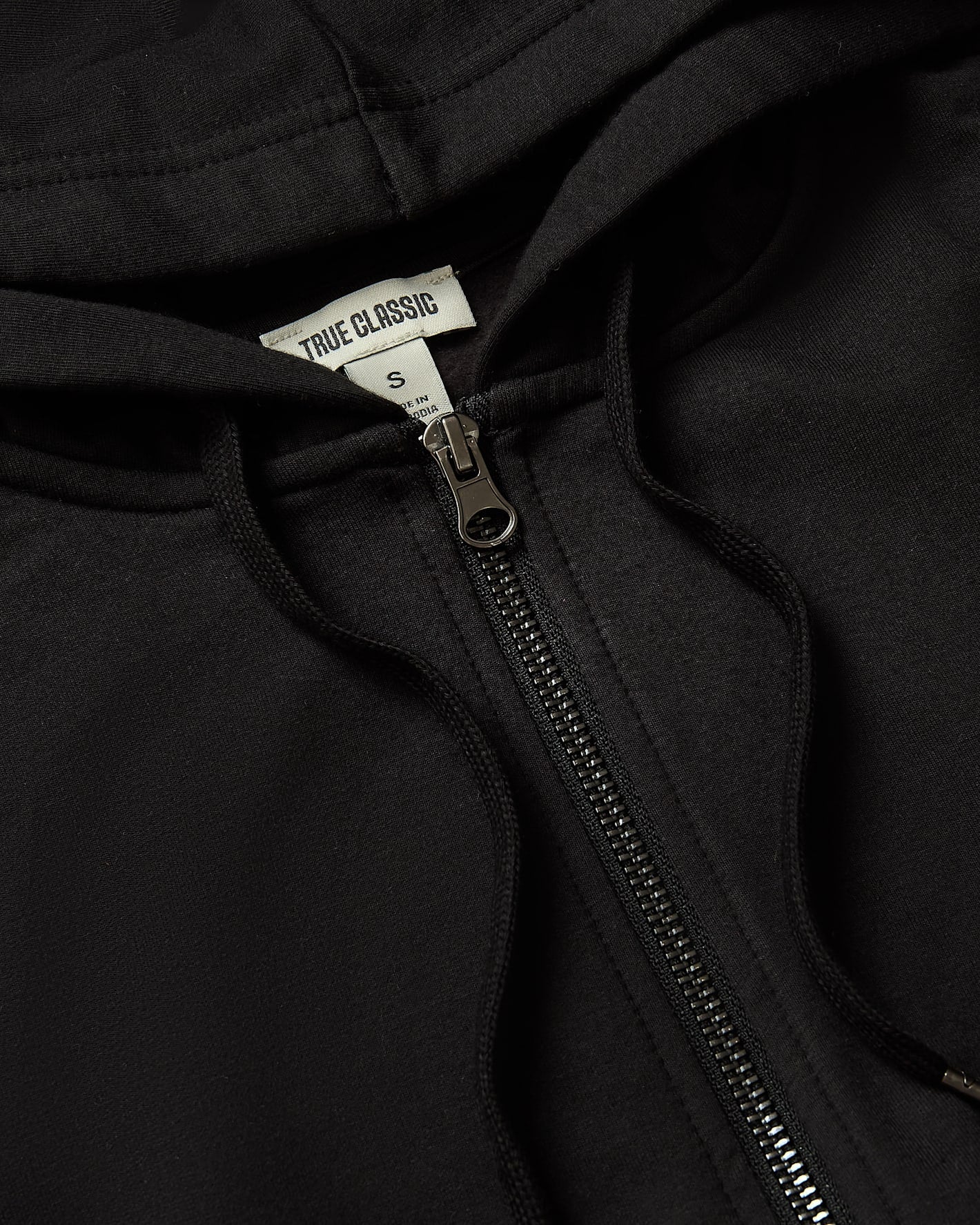 Womens Black Crop Zip Hoodie with metal zipper and drawcords.