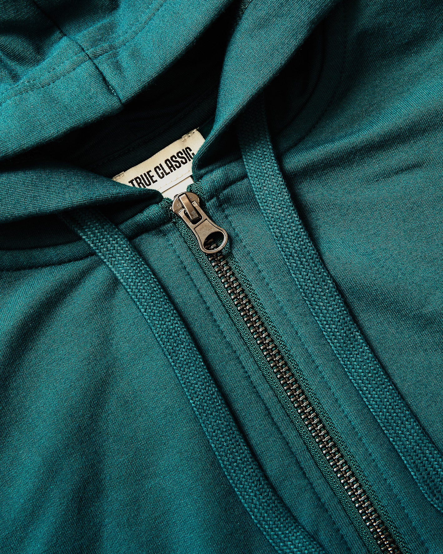Womens Deep Emerald Crop Zip Hoodie with metal zipper and drawcords.