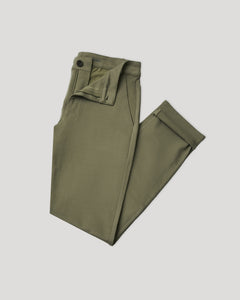 True ClassicMilitary Green Slim Comfort Knit Chino Pant folded with rolled cuffs.