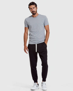 True ClassicMan wearing a gray t-shirt and black pants on a white background