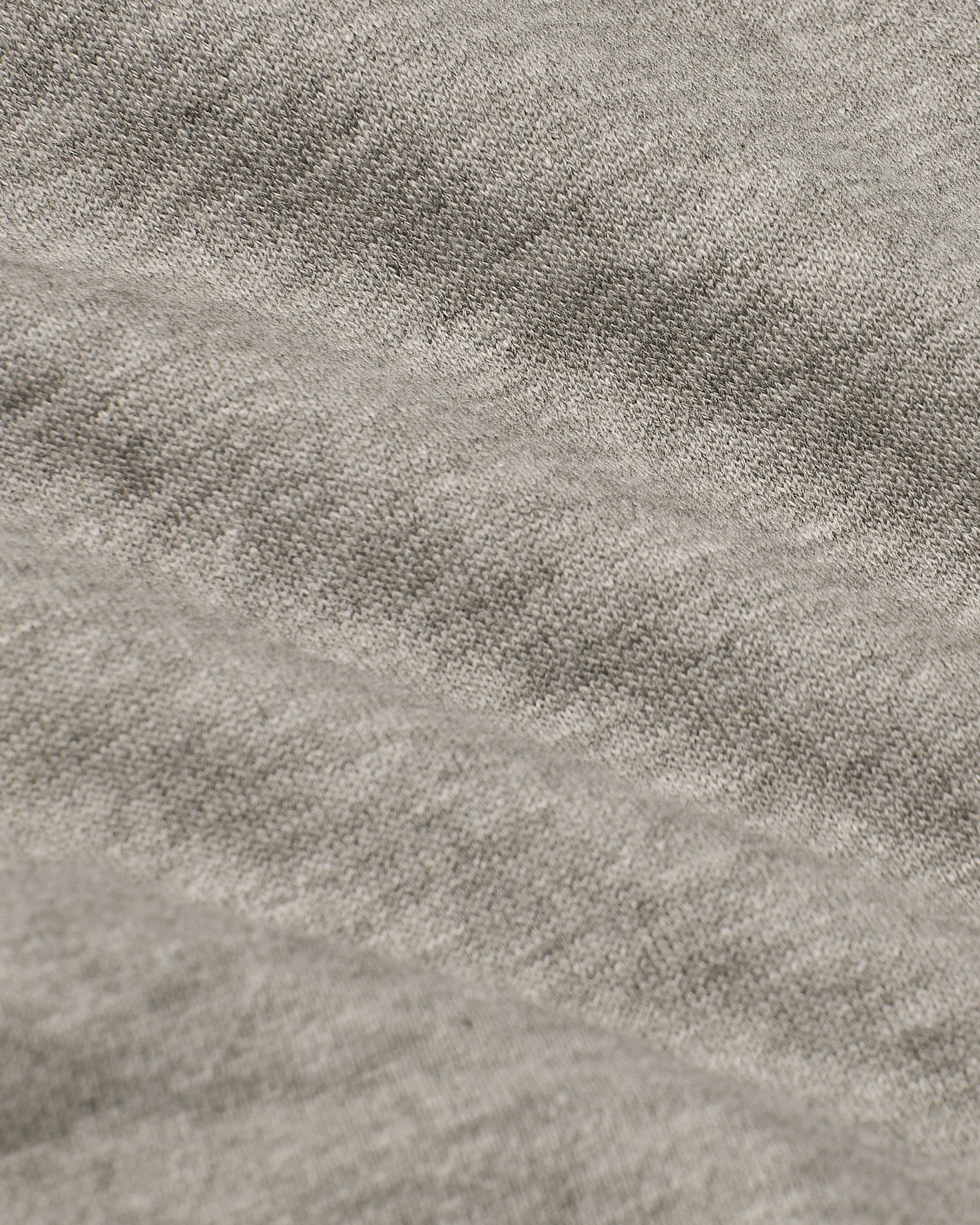 Dark Heather Gray Fleece French Terry Joggers fabric close-up, showcasing stitches.