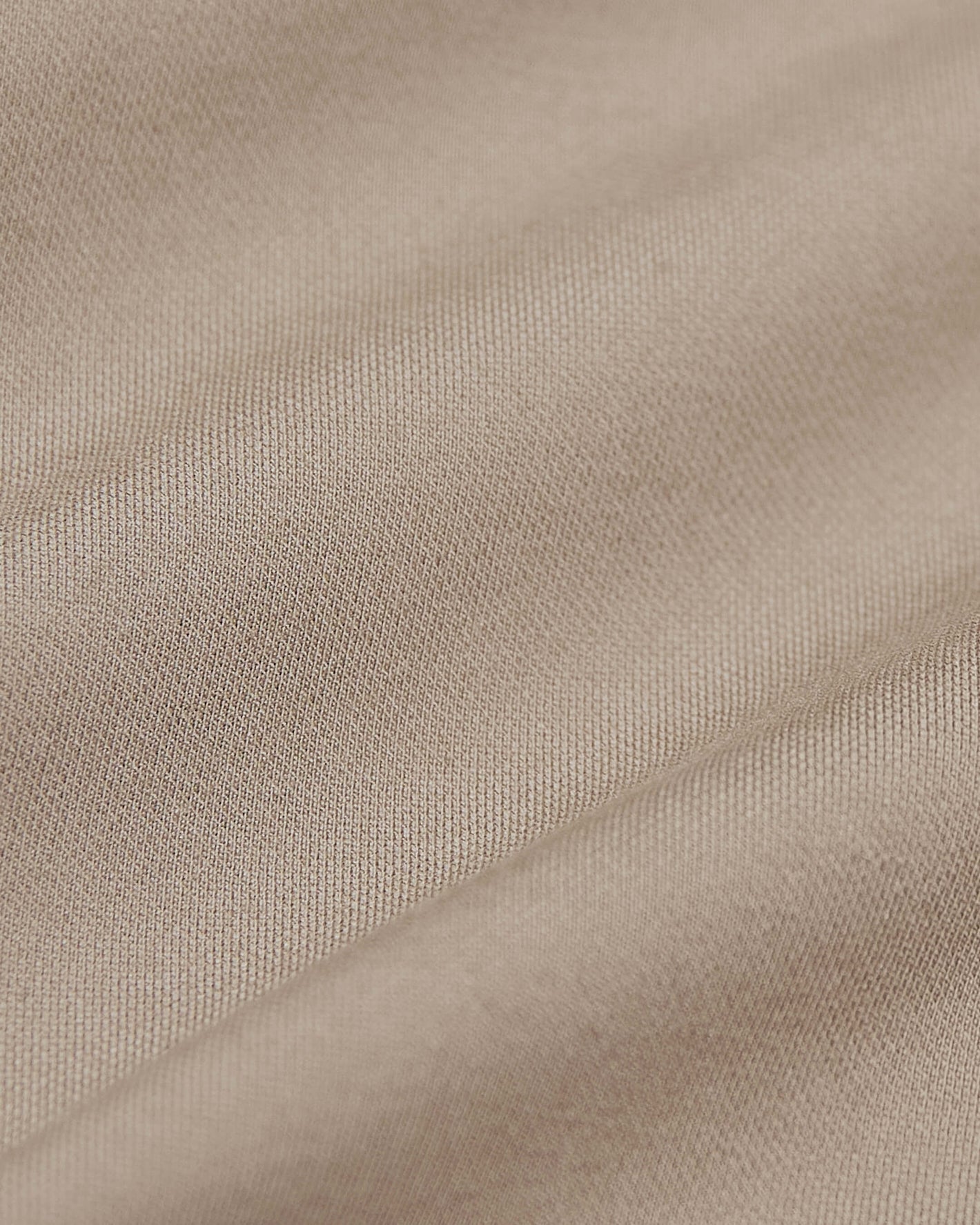 Khaki Commuter Pants close-up showing fine woven fabric texture.