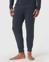 Heather Navy Loungewear Jogger modeled barefoot, showcasing elastic cuffs.