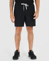 7 All Black Active Quick Dry Shorts 3-Pack on standing male figure.