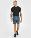 Man in Dark Heather Indigo Active Comfort Shorts and black t-shirt.