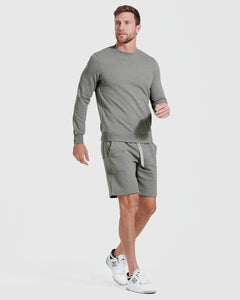 True ClassicMedium Heather Gray Fleece French Terry Shorts worn with white sneakers.