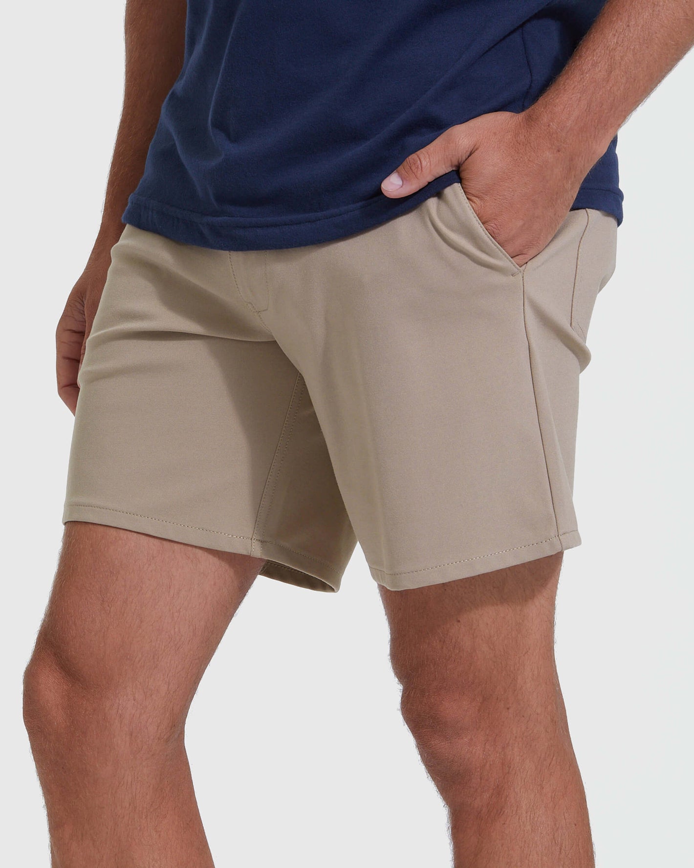 Khaki Commuter Short with hand in pocket, showcasing slim fit.
