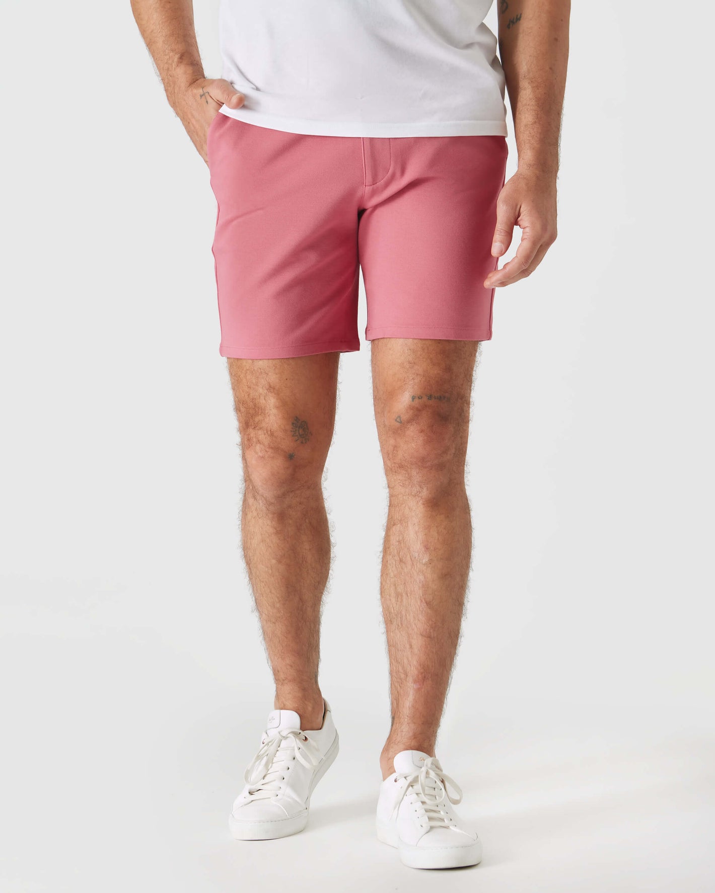 7 Rosewood Comfort Knit Chino Shorts worn with white sneakers.