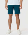Centurion Twill Short with tattoos and sneakers visible.