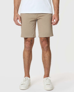 True ClassicMan wearing Khaki Twill Short, white sneakers, visible knee tattoos.