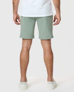 True ClassicMeadow Twill Short worn by a man, showcasing its slim fit.