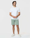 Man wearing Meadow Twill Short with white T-shirt and sneakers.