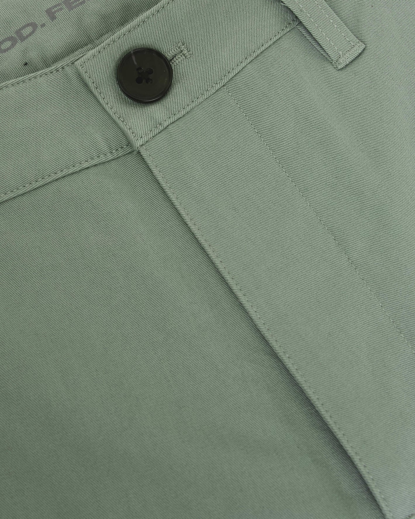 Meadow Twill Short waistband close-up with button and belt loop.