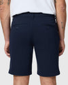 Back view of man in Navy Twill Short, white t-shirt.