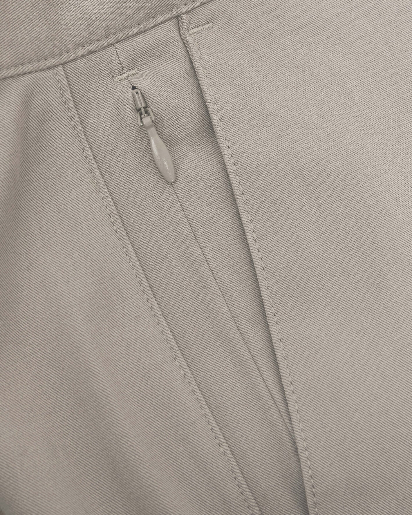 Close-up of Sandstone Twill Short's seam with concealed zipper.