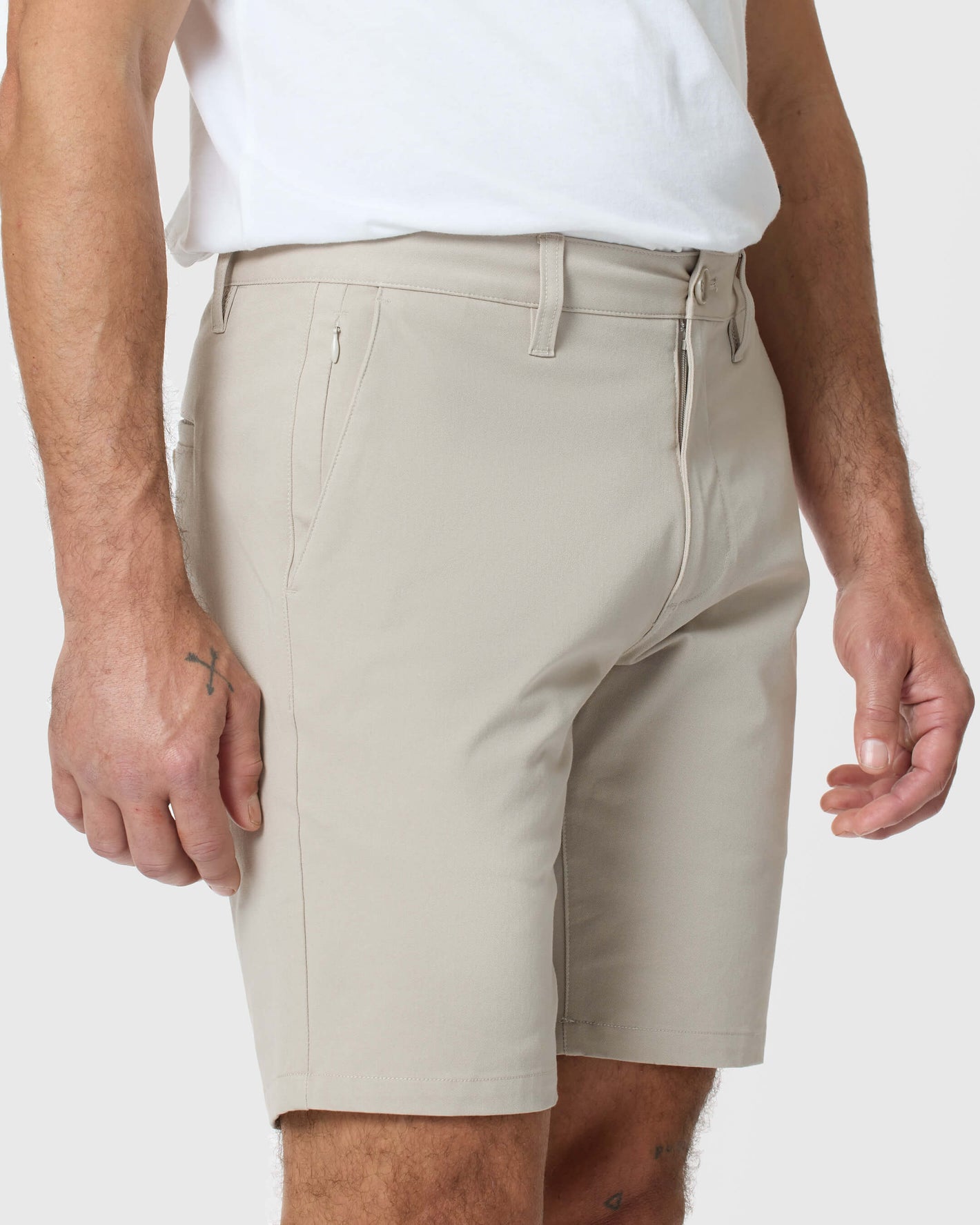 Sandstone Twill Short with belt loops, slanted pockets, and tattooed hand.