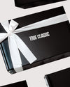 Gift Box with TRUE CLASSIC text and white satin ribbon.
