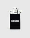 Gift Bag with braided handles and “TRUE CLASSIC” print.