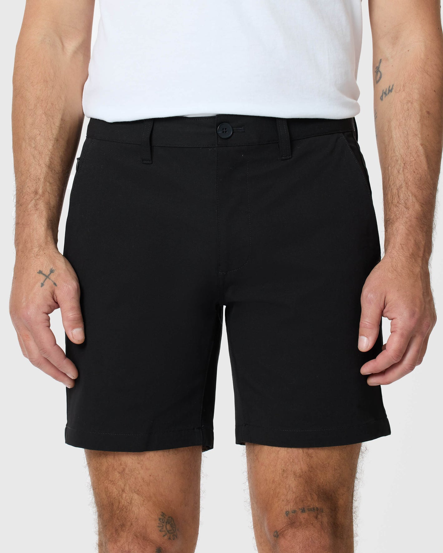 7 Black Classic Twill Shorts with button front, side pockets, and tattoos visible.