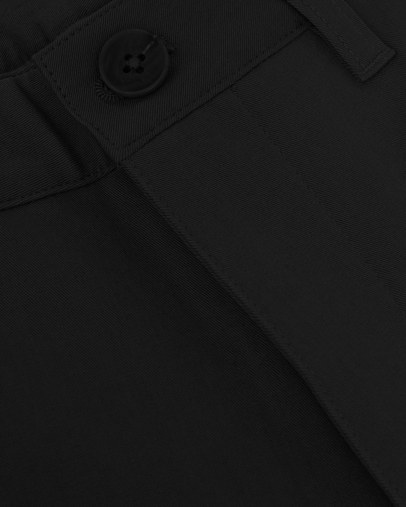 7 Black Classic Twill Shorts, close-up showing twill fabric and button.
