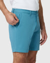 Person wearing 7 Harbor Classic Twill Shorts, tugging zippered pocket.