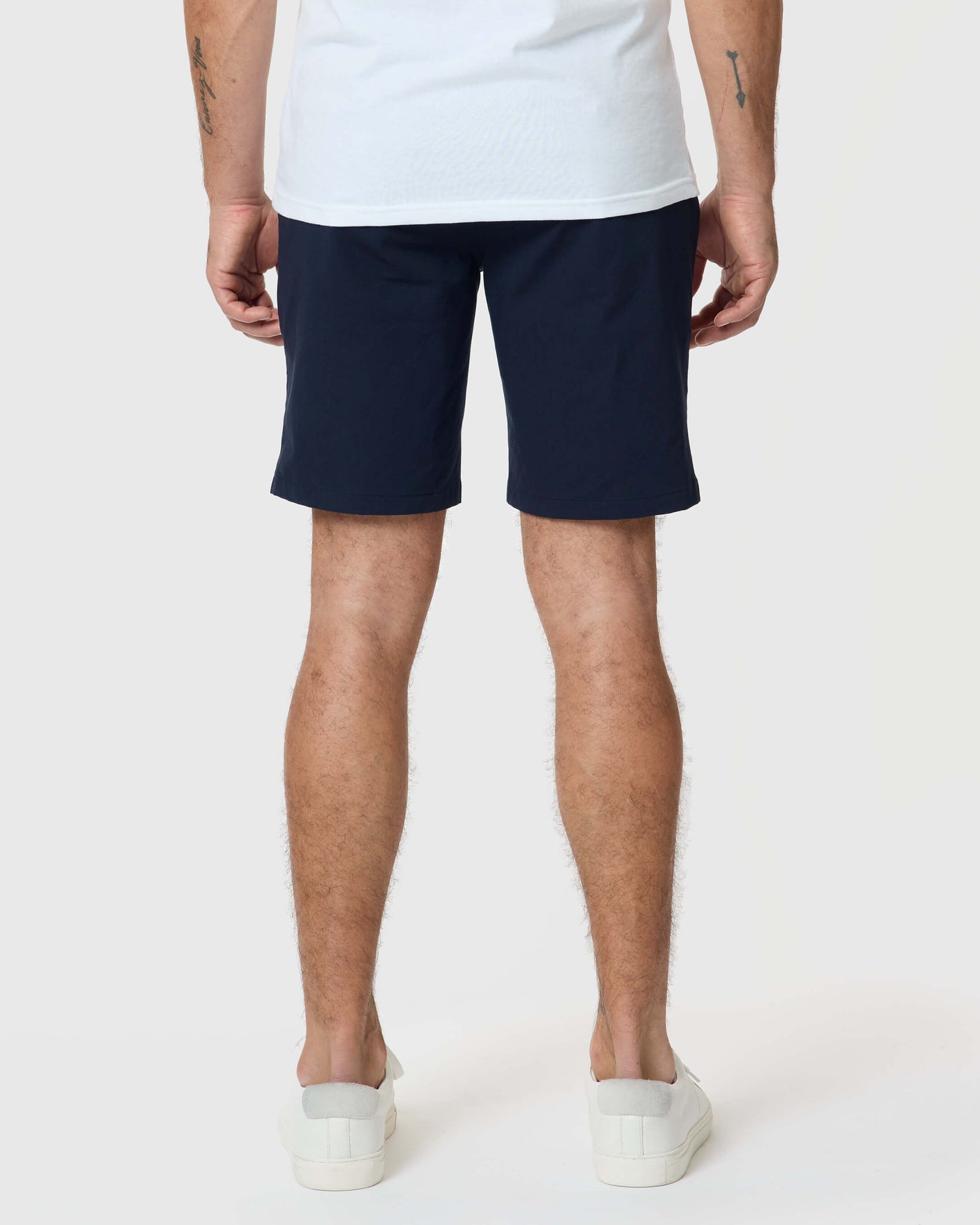 Back view of man wearing 7 Navy Classic Twill Shorts.