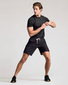 Young male in Black 9 Active Quick Dry Shorts, athletic stance.